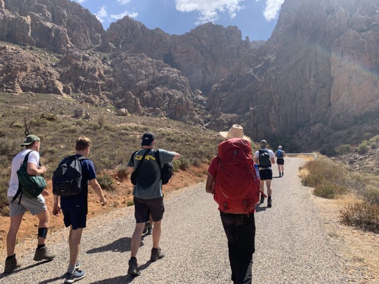 Hiker walking to a gîte after completing the second stage of Jbel Lkest trek in Morocco